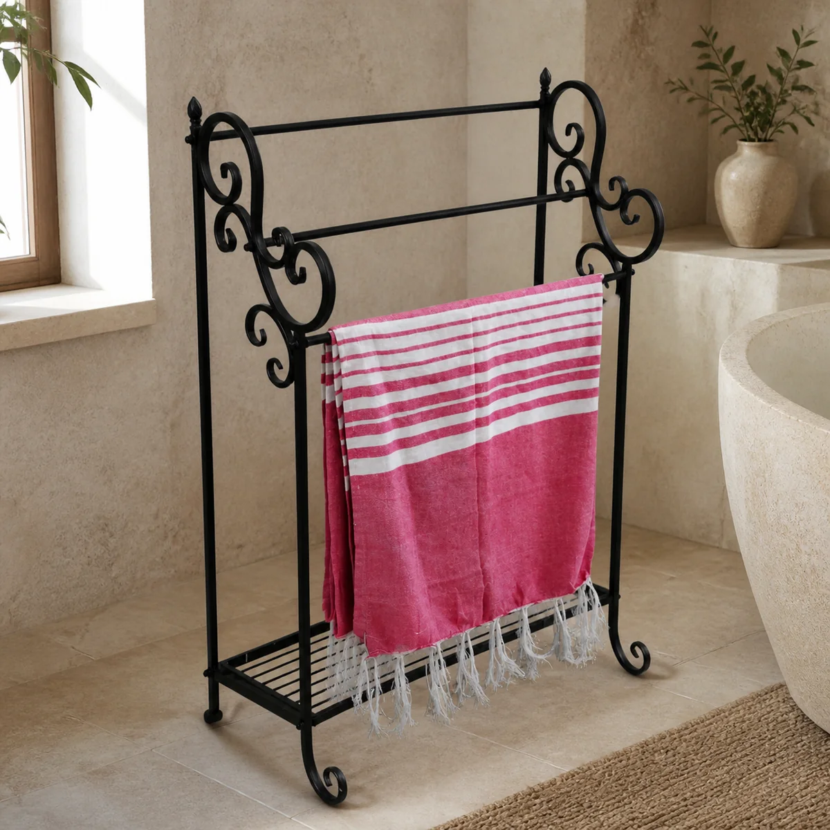 Erongo Scroll Towel Rail staged in a pale stone bathroom.